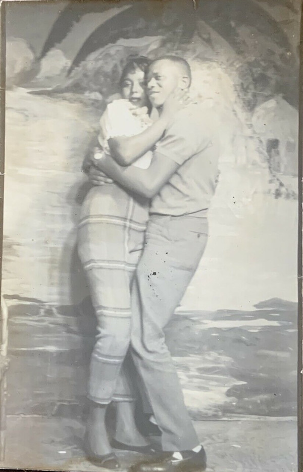 Couple with beach backdrop by Unknown