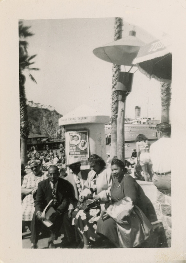 Group sitting outside the Avalon Casino Theatre, Catalina Island by Unknown