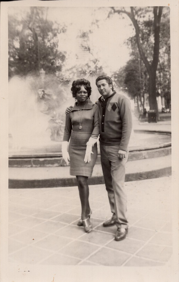 Blaxican couple in front of fountain by Unknown