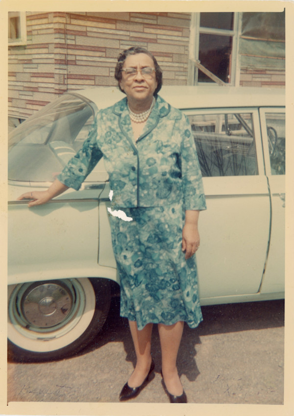 Woman in blue floral suit by Unknown