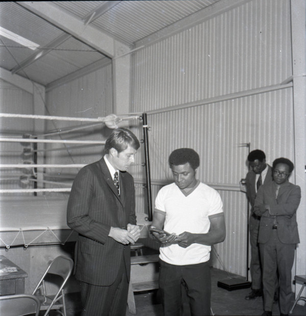Men at boxing ring by Unknown