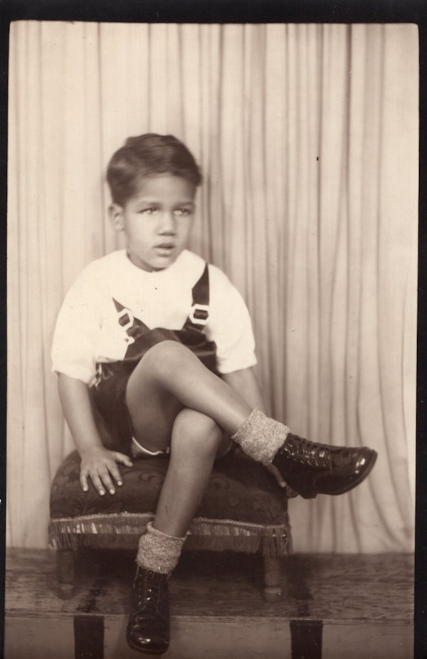 Boy with crossed leg by Unknown