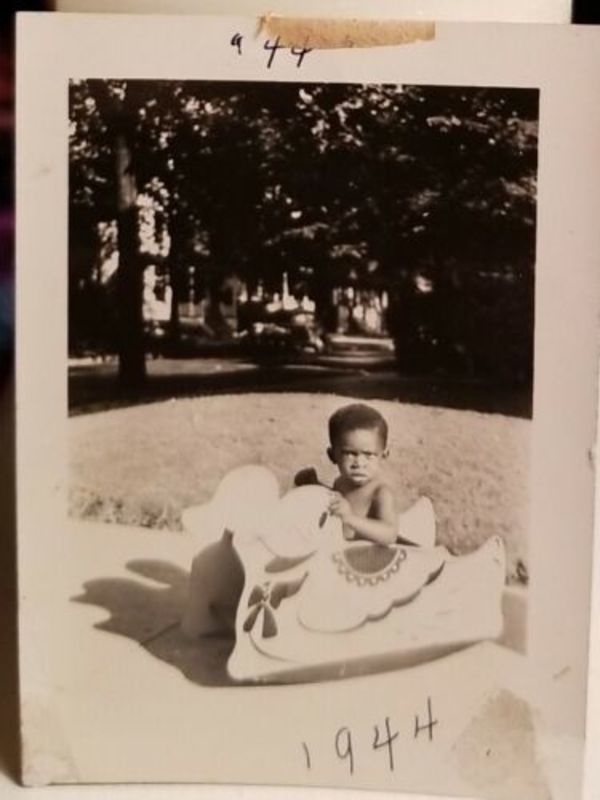 Boy with duck toy by Unknown