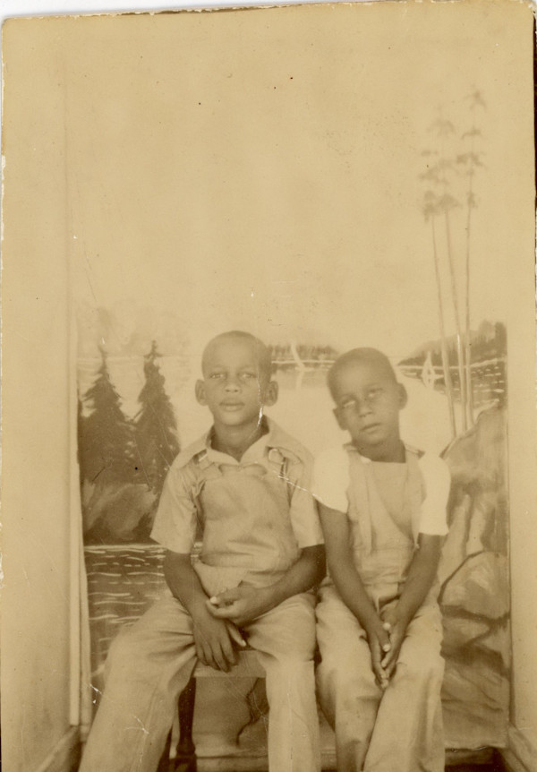 Two boys with landscape backdrop by Unknown