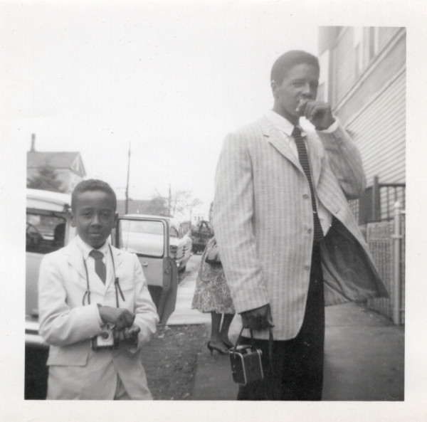 Two boys with cameras by Unknown