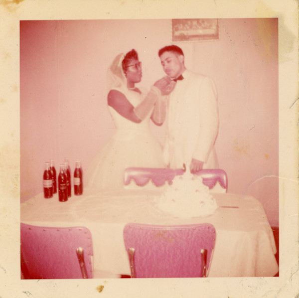 Bride feeding groom cake by Unknown