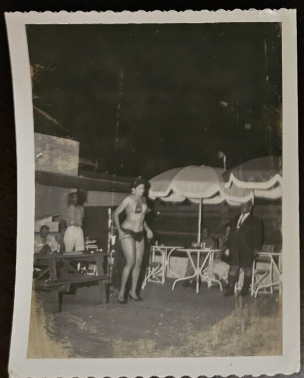Burlesque dancer outdoors by Unknown