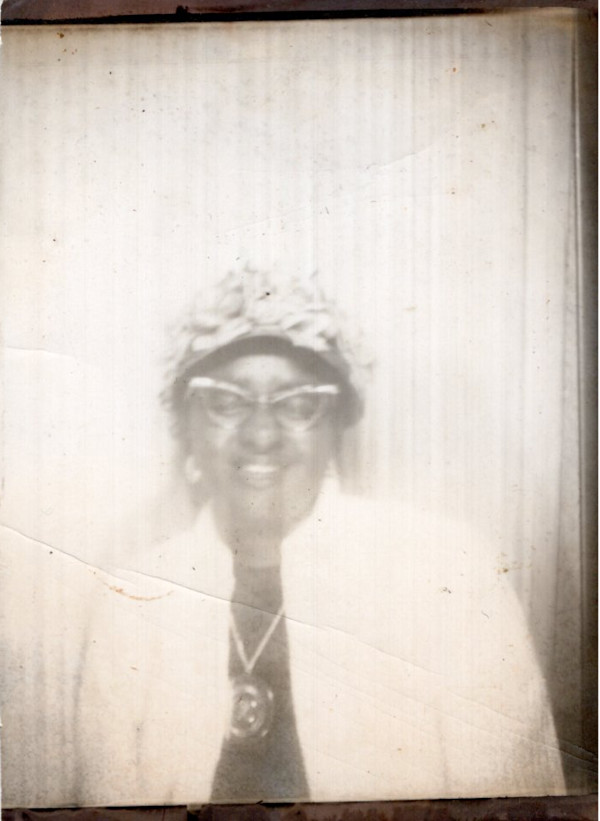 Woman with cat eye glasses and eyes closed by Unknown