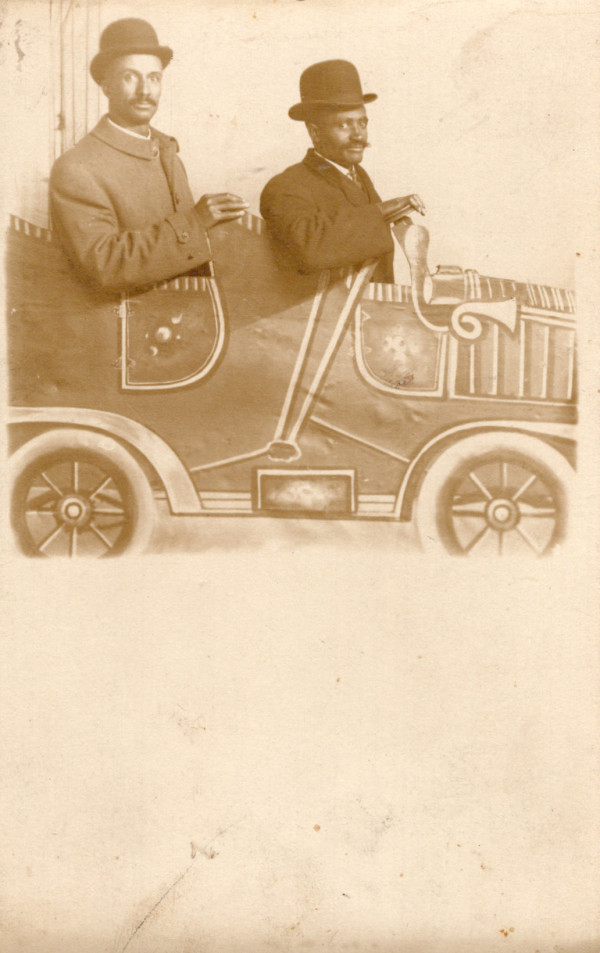 Two men in prop car by Unknown