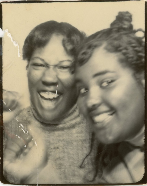 Two young women laughing by Unknown