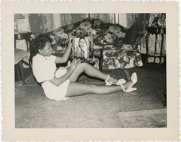 Cheesecake (gazing at man’s portrait) by Unknown
