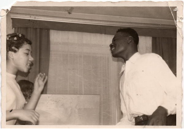 Young man and woman dancing by Unknown