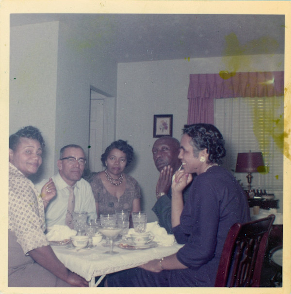 Group around small table with Lillie Estes Stark at center by Unknown