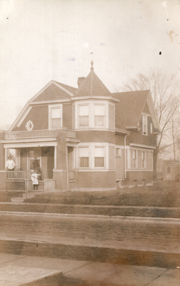 Family on porch by Unknown