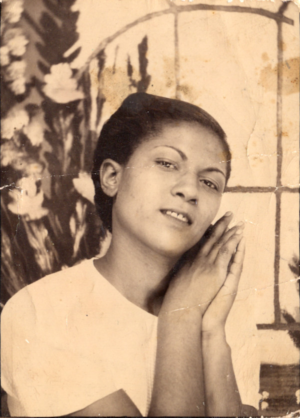 Woman in hands on face pose by Unknown