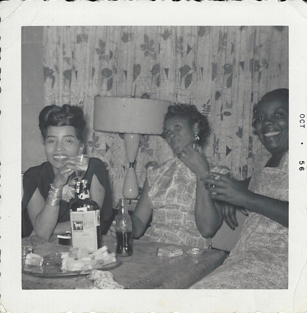 Three women having drinks by Unknown