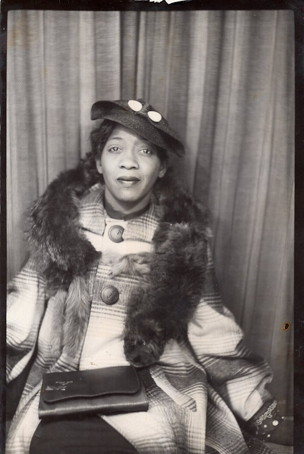 Woman in fox fur stole by Unknown