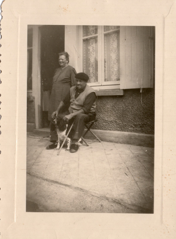 Couple with dog by Unknown