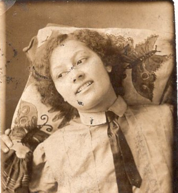 Gem miniature of woman with head against butterfly cushion by Unknown