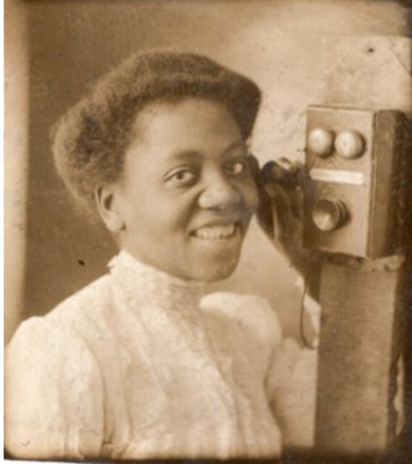 Gem miniature of woman with telephone by Unknown