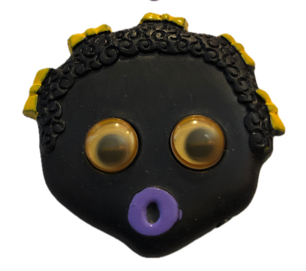 Golliwog pin (girl with bows) by Unknown