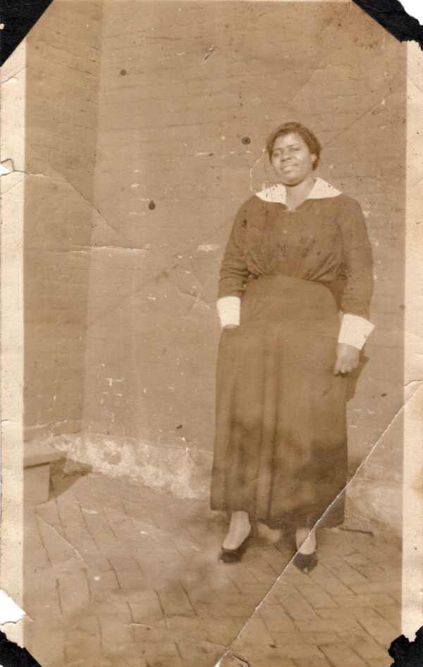 Woman with hand in pocket by Unknown