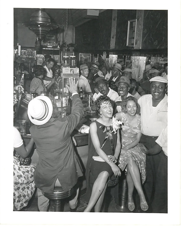 Happy folks in a bar by Unknown