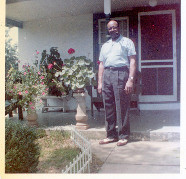 Horace Estes in front of house by Unknown