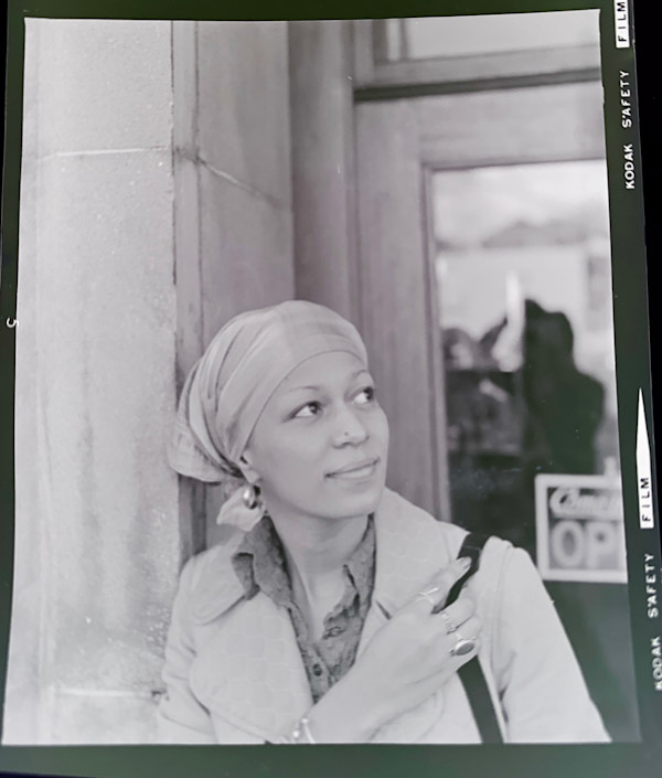 Woman wearing head scarf by Unknown