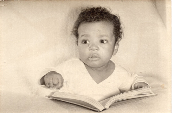 Infant with book by Unknown