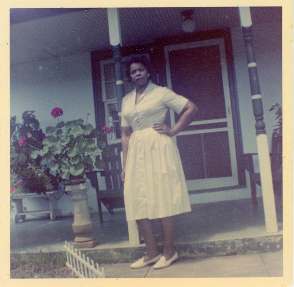 Lillie Estes Starks in front of house by Unknown