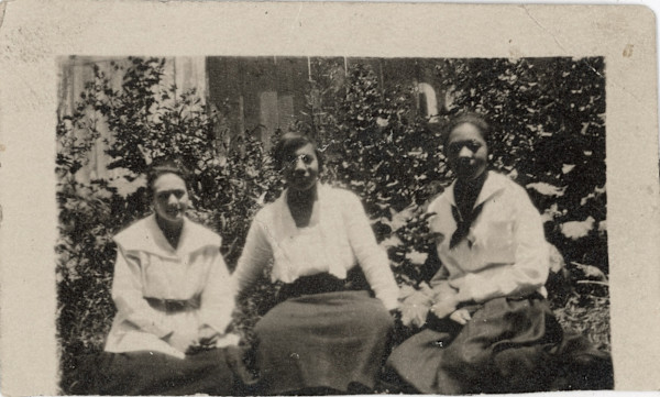 Three women sitting outside by Unknown