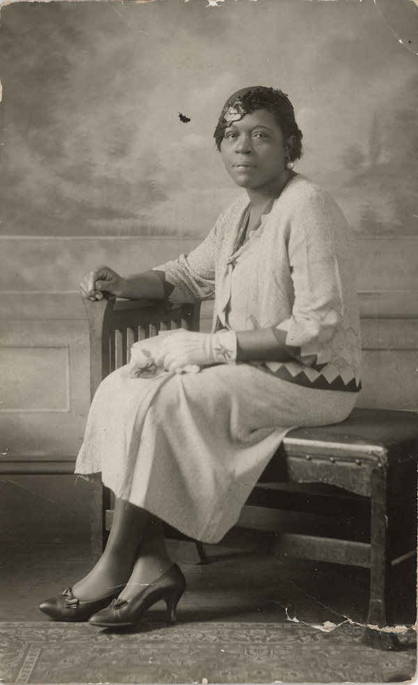 Elegant seated woman by Unknown