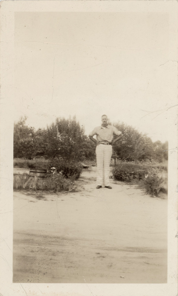Man standing outdoors by Unknown