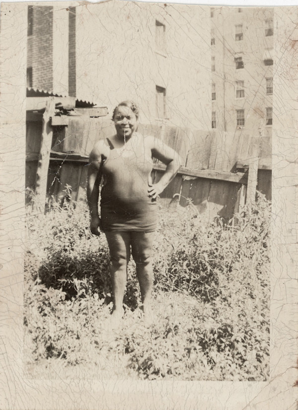 Woman in swimming costume standing outside by Unknown, Peoples Drug Stores
