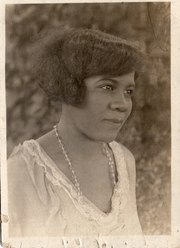Lovely woman in glass necklace by Unknown