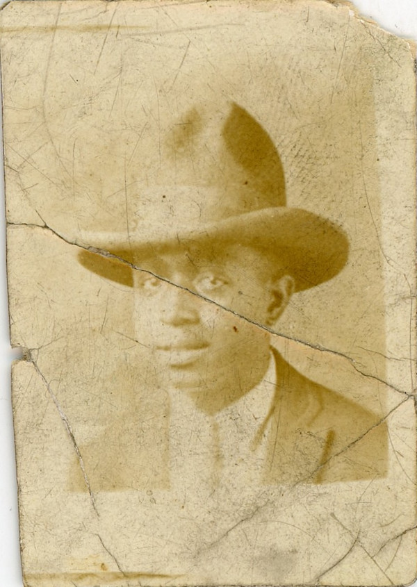 Man in high crown hat by Unknown