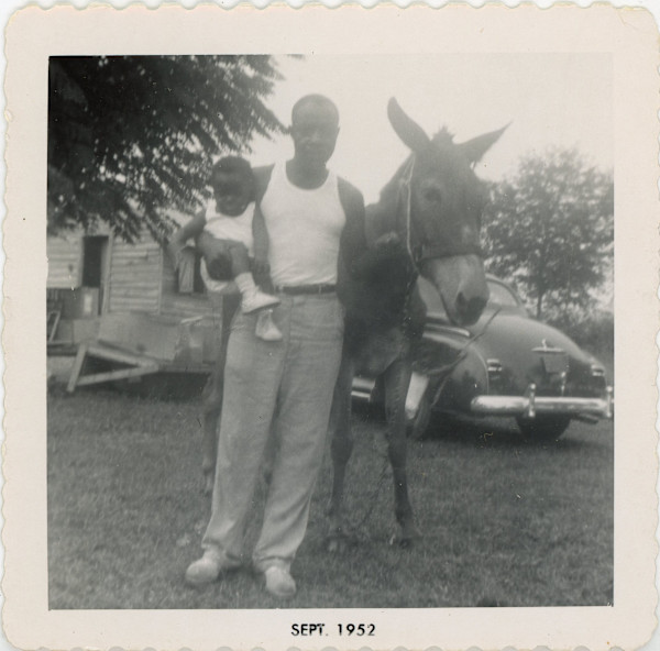 Man, baby, & mule by Unknown