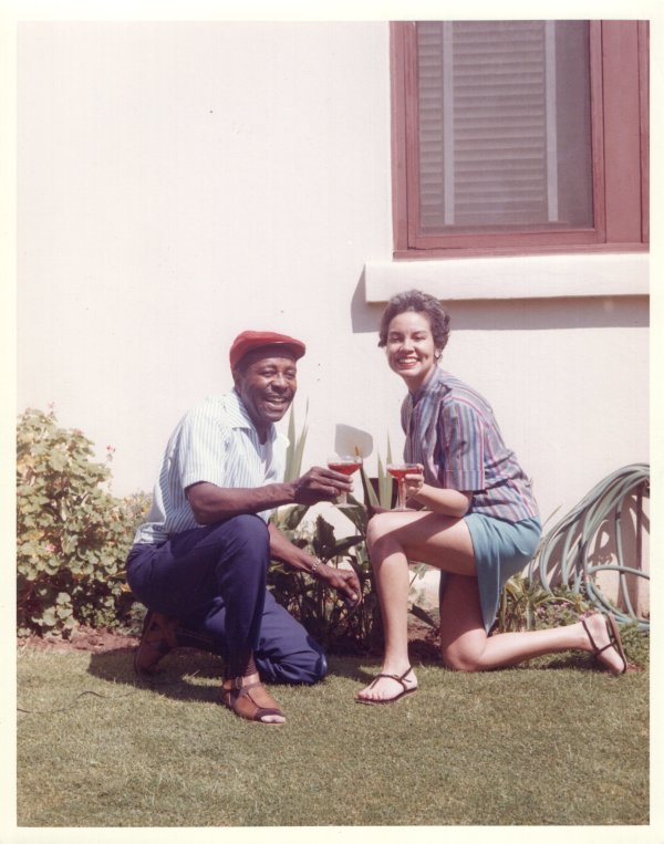 Louis & Martha at home with cocktails by Unknown