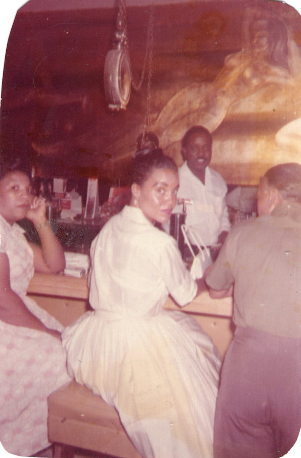 Martha Weaver sitting at a bar by Unknown