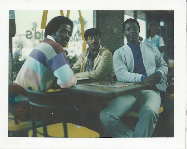 Miller, Mason, and unidentified man, McDonald’s, LA by Unknown