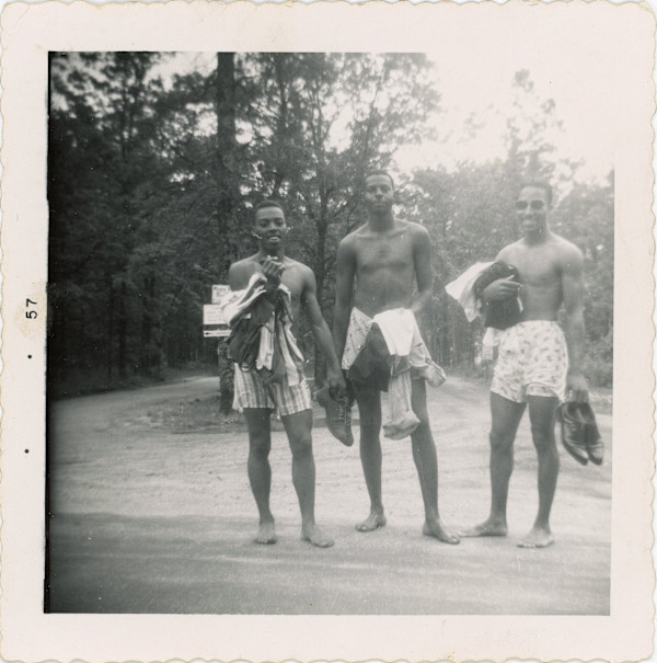 Three men in swim trunks by Unknown