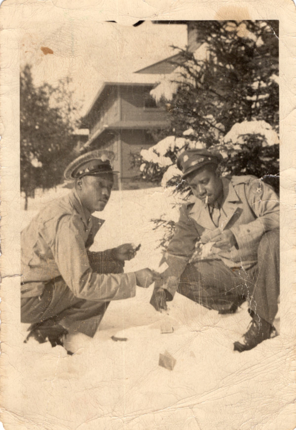 Two soldiers throwing dice in the snow by Unknown