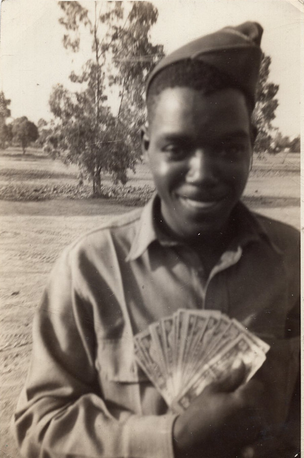 Soldier fanning money by Unknown