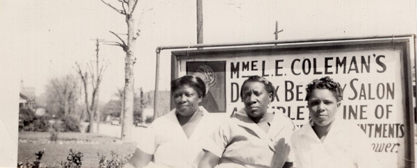 Three women in front of sign for Mme. L. E. Coleman’s D____ Beauty Salon by Unknown