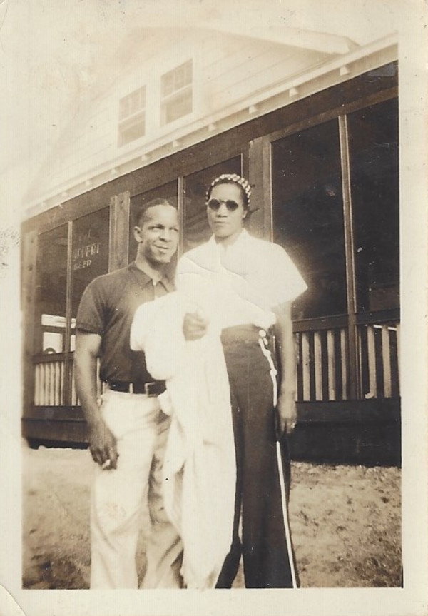 Couple outside of bar by Unknown