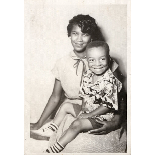 Mother with son on lap by Unknown