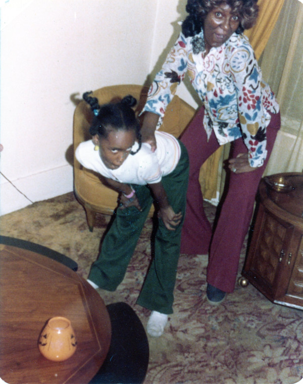 Mother and daughter posing by Unknown