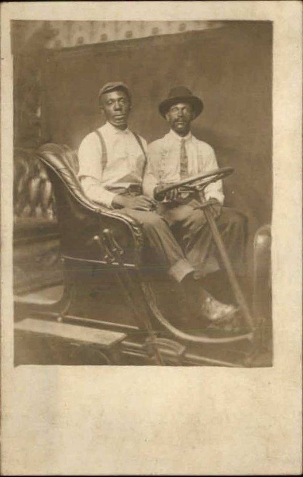 Two men in prop car by Unknown