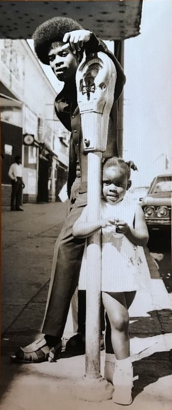 Man and girl with parking meter, Oakland, California by Unknown